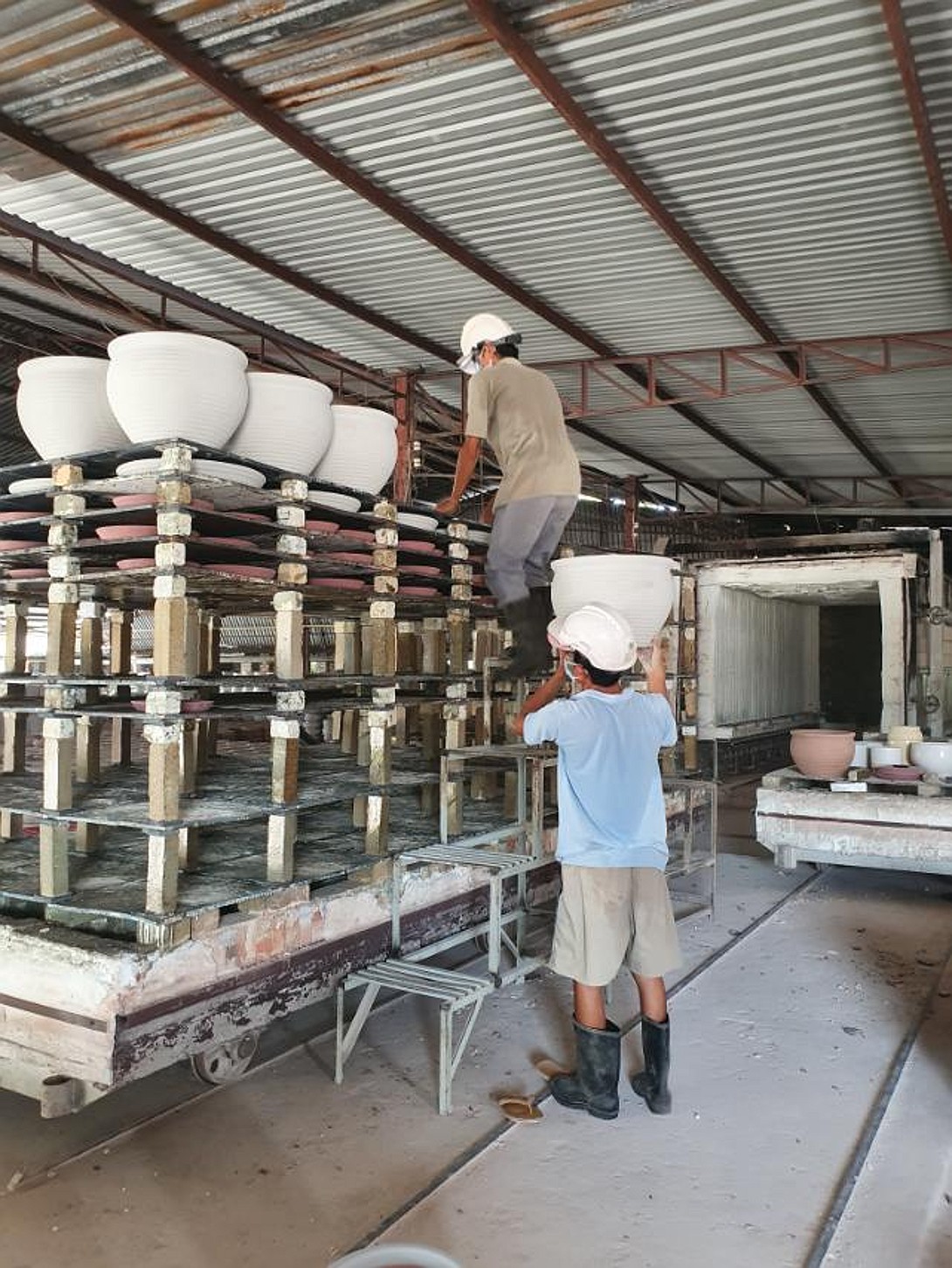 Loading bowls into the kiln